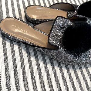 Ann Taylor black sparkly slip ons with fur pom pom